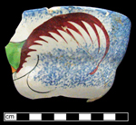 Double-curve (Canova) shape refined white earthenware cup with painted peafowl and sponged blue motif - click to see larger image.